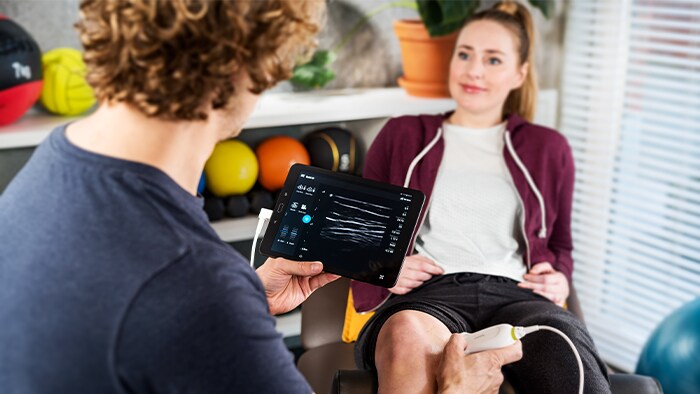 Clinician checking ultrasound image of a patient on a tablet