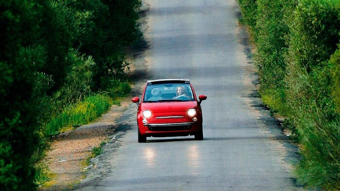 red car on the road